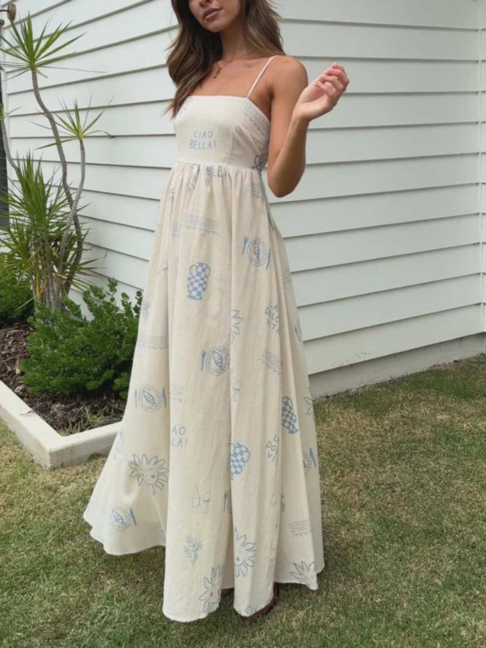 Lightweight women's summer sundress, long and flowy, showcasing a stylish open back design.