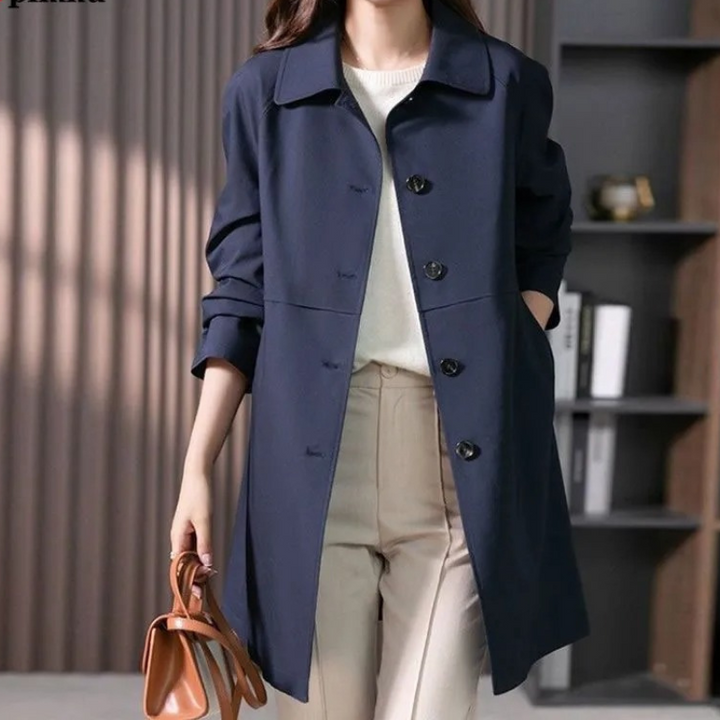 Versatile women's single-button trench coat. Stylish outerwear with a tailored fit for casual or office wear.