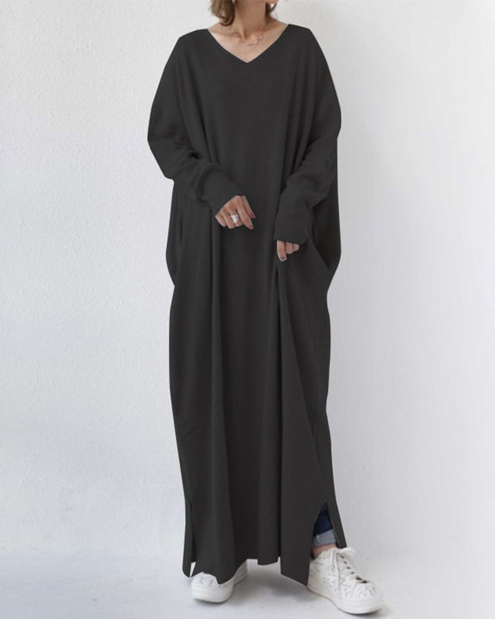 Cozy women's winter maxi dress with flowing long sleeves, ideal for comfortable seasonal fashion.