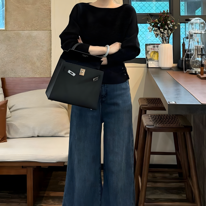 Cozy knit women's off-the-shoulder pullover, featuring batwing sleeves & a relaxed fit for everyday wear.