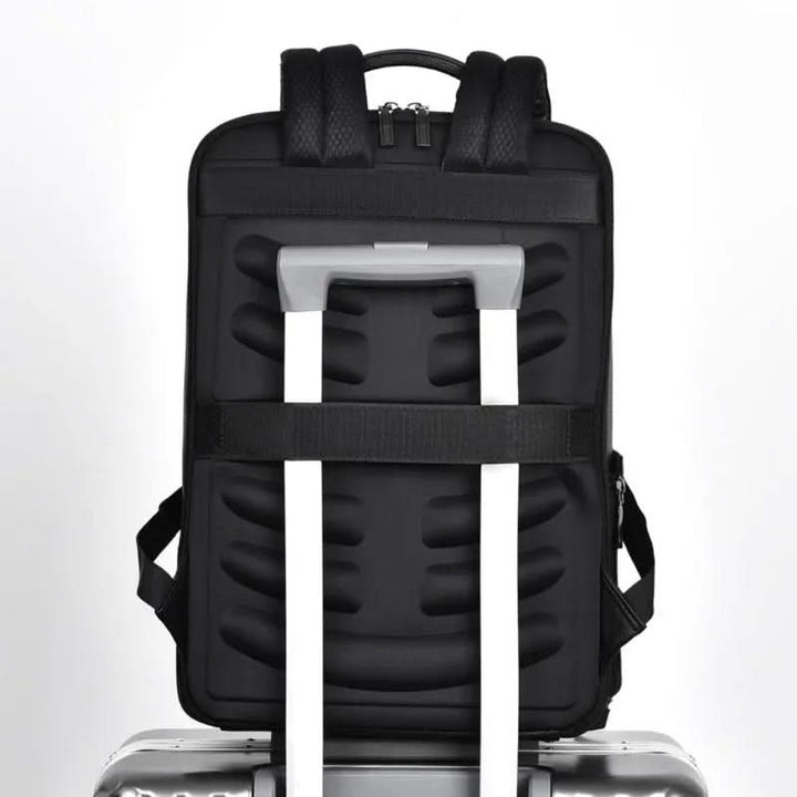Professional unisex work backpack, black PU leather, with convenient USB port & anti-theft pocket.