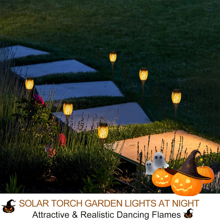 An 8-pack of easy-to-install solar lights, casting a realistic flickering flame on a fence line.