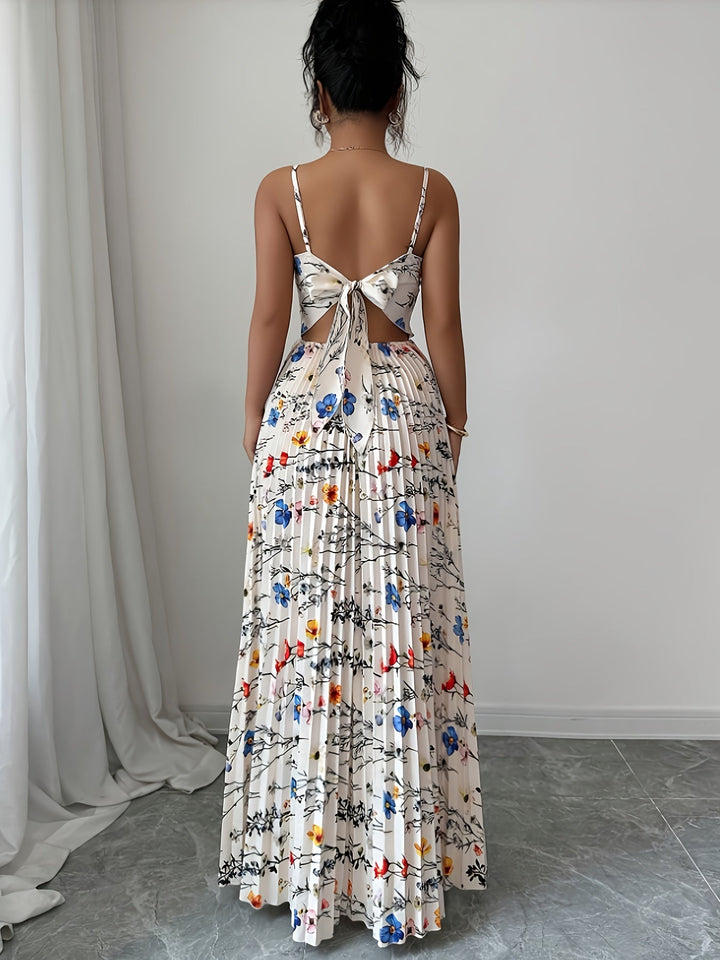 Long women's floral pleated maxi dress in elegant style. Comfortable summer fashion for any special occasion.
