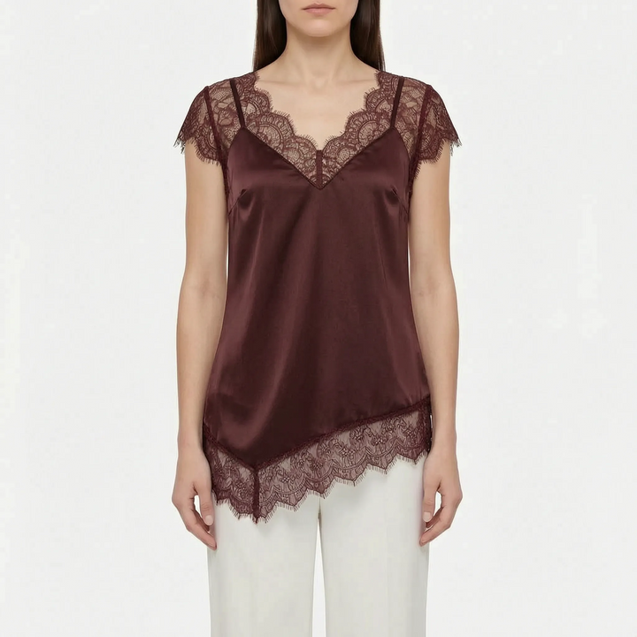 Chic women's sleeveless asymmetrical top with sheer details & unique design. Ideal elegant party wear blouse.
