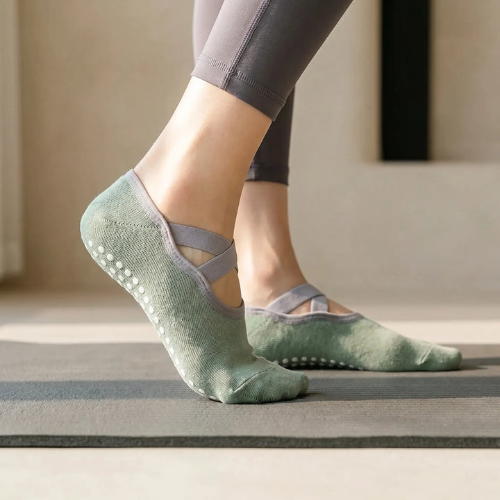 Women's green ballet studio grip socks for yoga, pilates & barre, featuring non-slip soles.