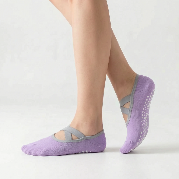 Green women's non-slip studio grip socks for yoga, pilates, dance, and barre fitness.