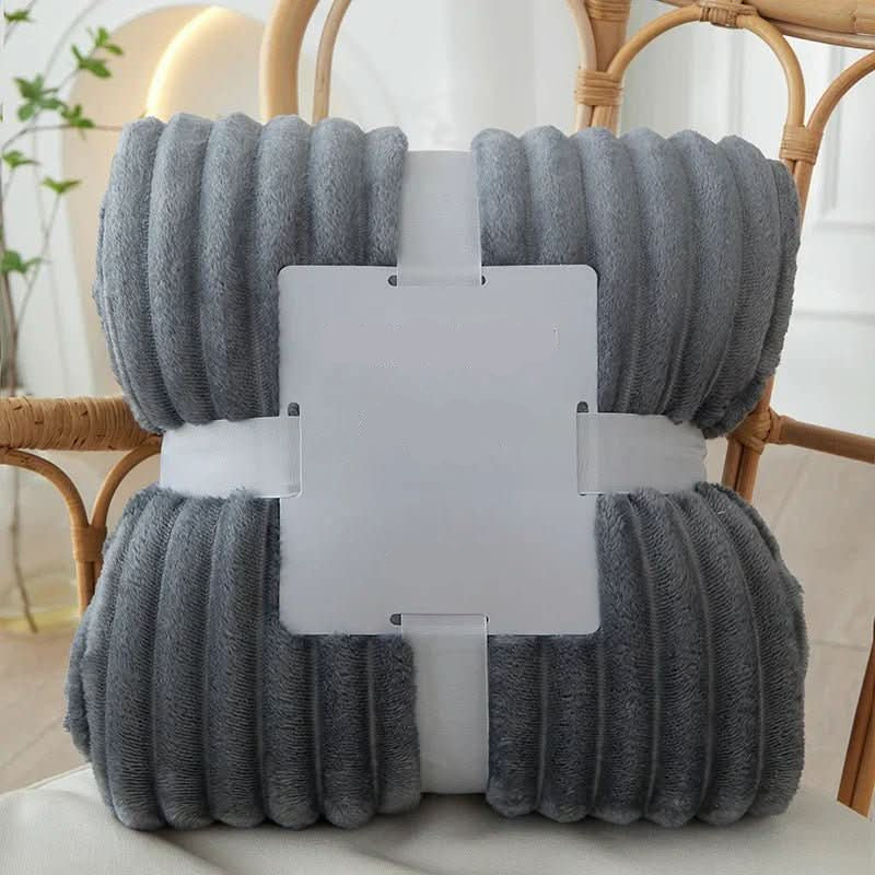 Plush flannel fleece throw blanket, providing ultimate soft comfort and cozy warmth for relaxation.