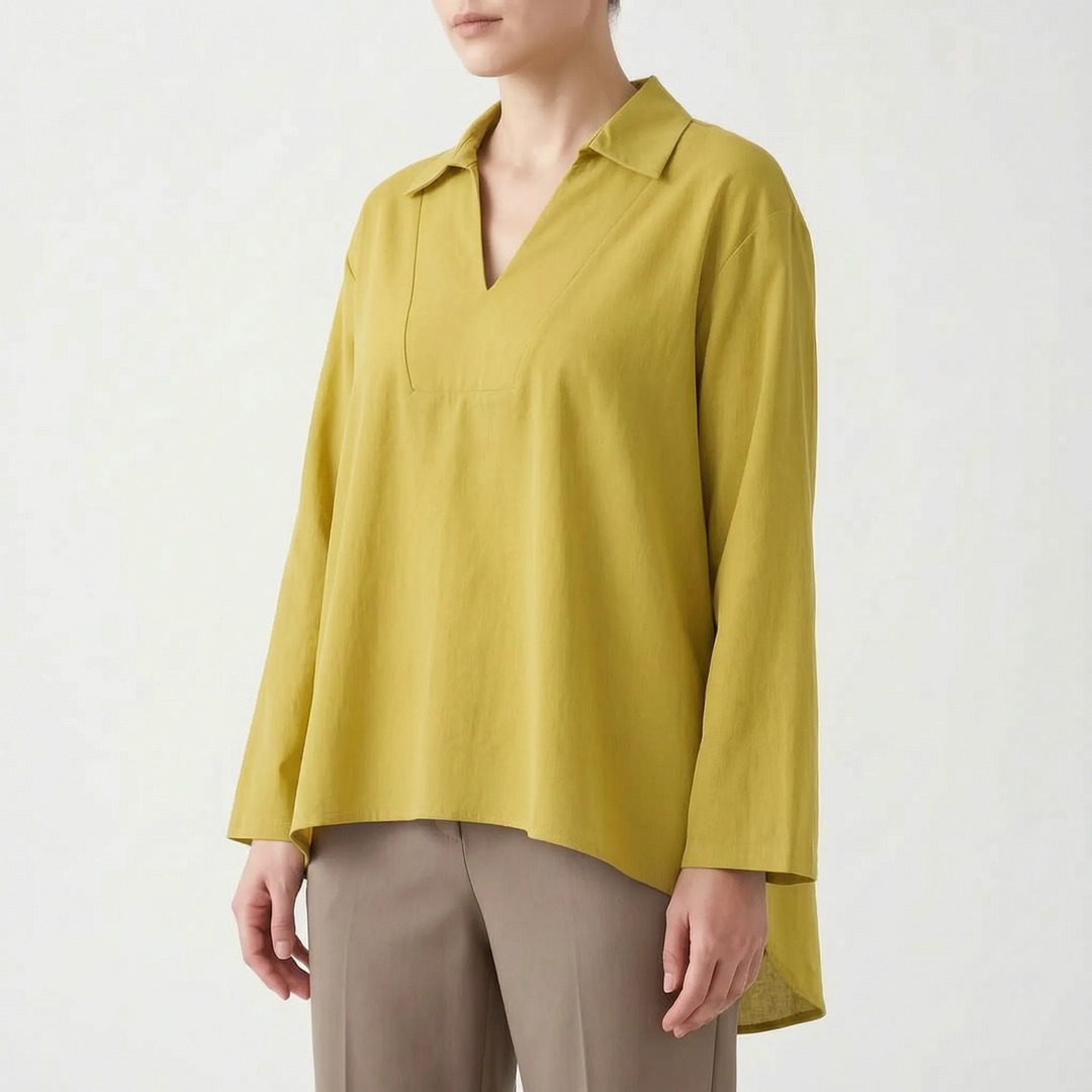 Fashionable women's long sleeve high-low tunic. Solid color v-neck blouse, versatile for casual or dressy looks.