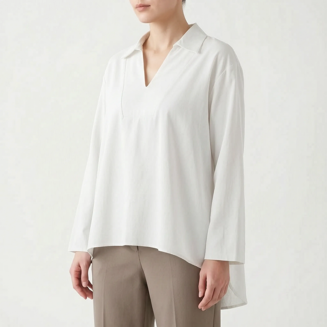 Solid color women's high-low tunic blouse. V-neck, long sleeve, relaxed fit, casual top for versatile styling.