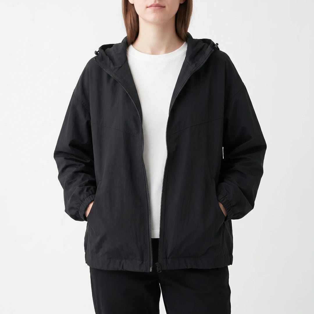 Loose fit women's lightweight windbreaker, hooded for everyday comfort. Ideal activewear or transitional jacket for women.