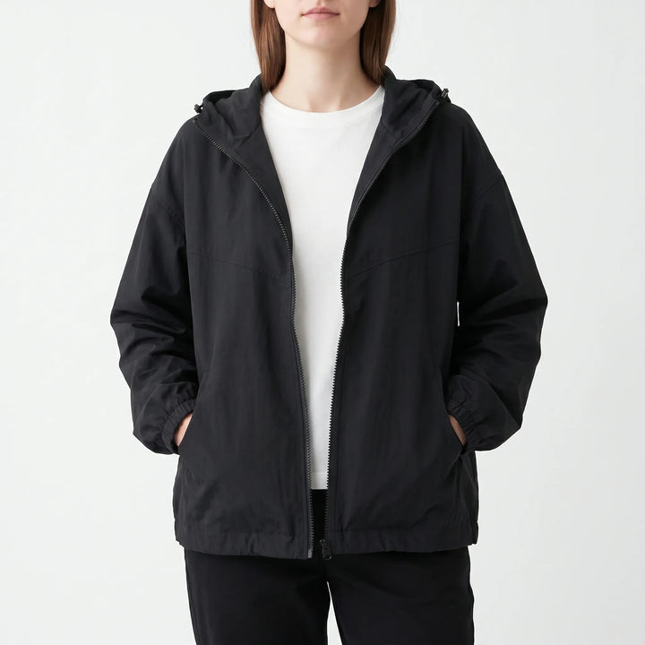 Loose fit women's lightweight windbreaker, hooded for everyday comfort. Ideal activewear or transitional jacket for women.