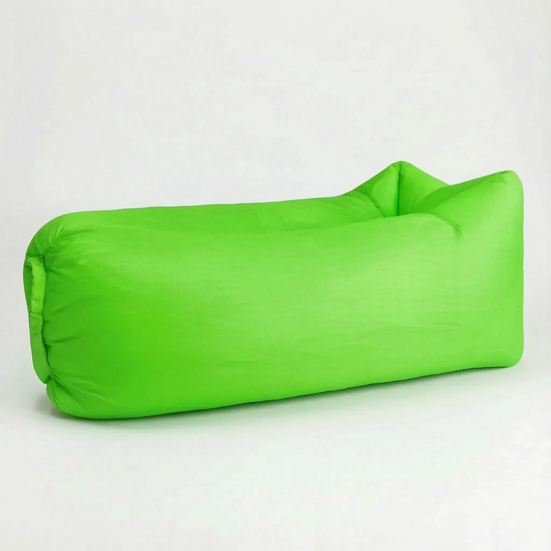 Compact packed portable inflatable air lounger bag next to a deployed one, showing travel readiness.