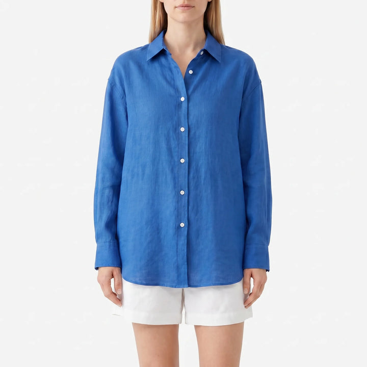 Trendy women's oversized blue button-up blouse, a lightweight & loose long sleeve summer top for effortless style.