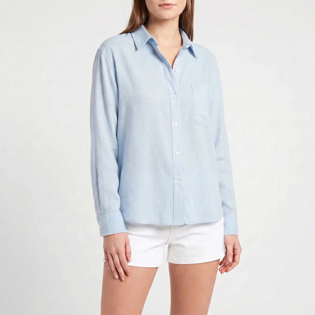 Classic women's long-sleeve button-up blouse, great for a smart casual or relaxed look.