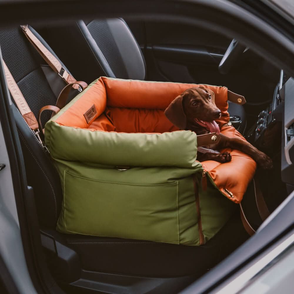 Plush pet booster seat ensures travel safety & comfort for small dogs. Stylish faux leather finish.