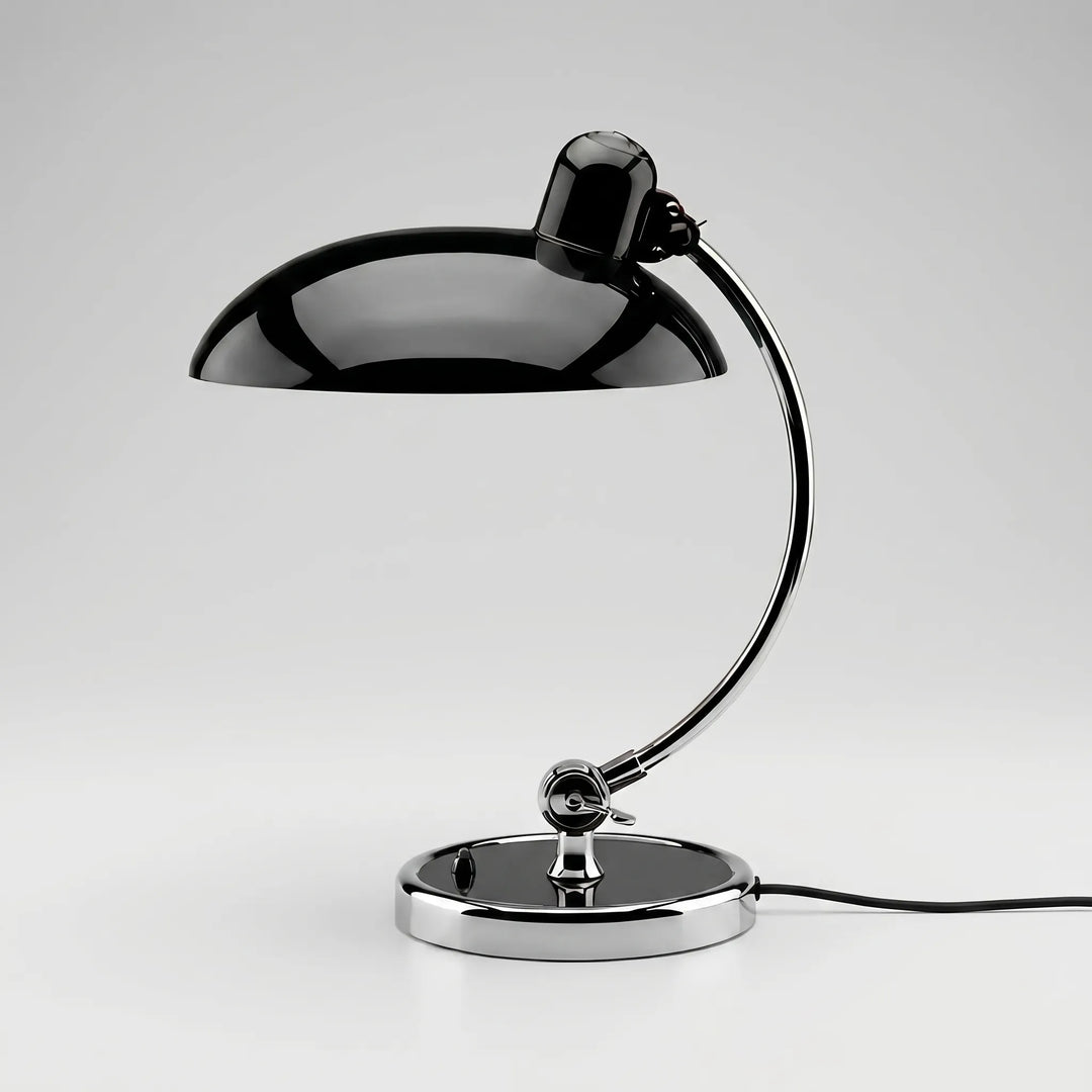 Stylish black metal dome desk lamp with an adjustable arm for targeted reading and task lighting.