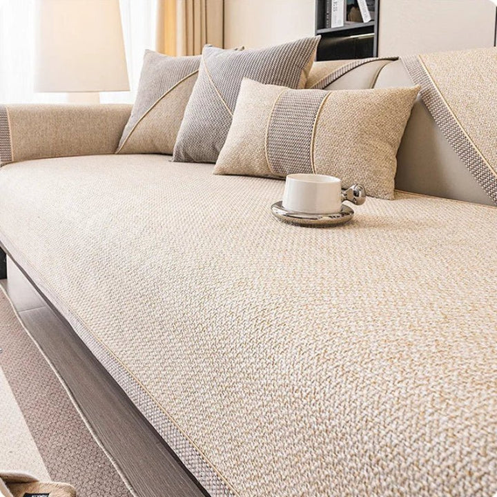 Comfortable, quilted cotton-linen sofa cover in a neutral style. Non-slip design adds elegance & protection to any couch.