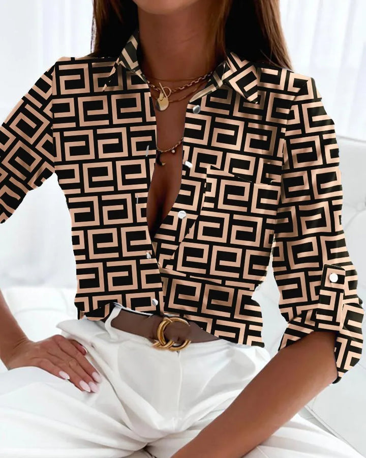 Sophisticated women's artistic print blouse with long sleeves, great for elegant casual wear.