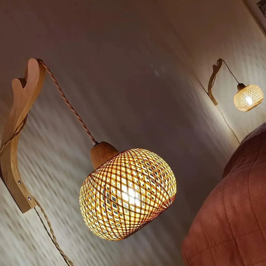 Elegant rattan wall sconce, handwoven with natural materials for a bohemian lighting accent.