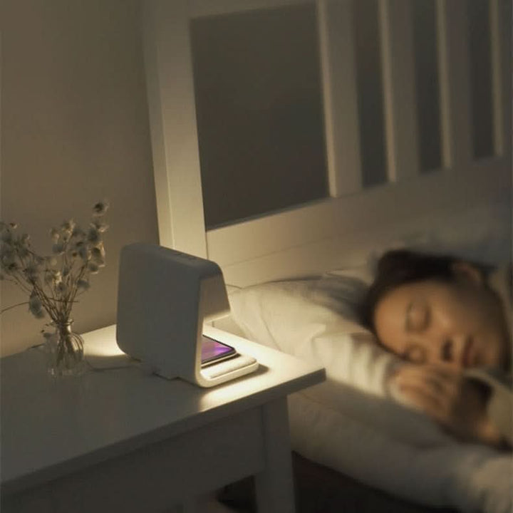 Multifunction dimmable LED light, wireless charger, & digital clock, crafted from modern ABS plastic.