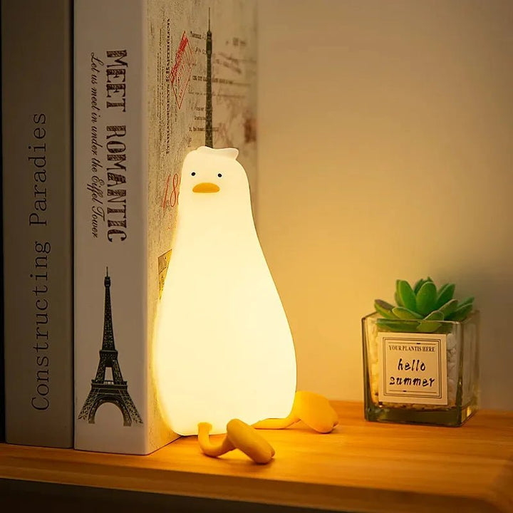 Soft silicone dimmable night light, safe for kids & babies, provides a warm, cozy glow for sleep.
