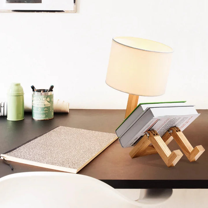 Elegant adjustable wooden table lamp with natural wood finish, fabric shade, and integrated storage.