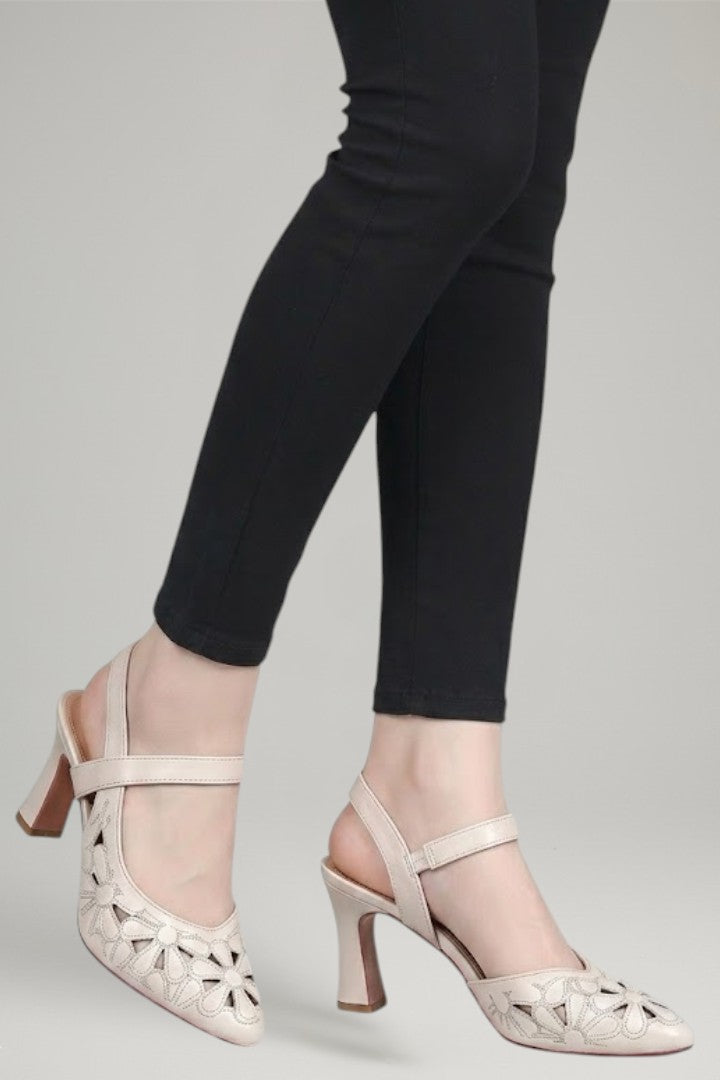 Fashionable women's buckle heels in white, featuring cushioned comfort & secure adjustable strap.