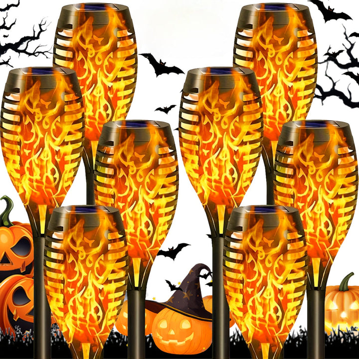 Solar-powered outdoor flickering flame lights, 8-pack for garden, patio & pathway ambiance.