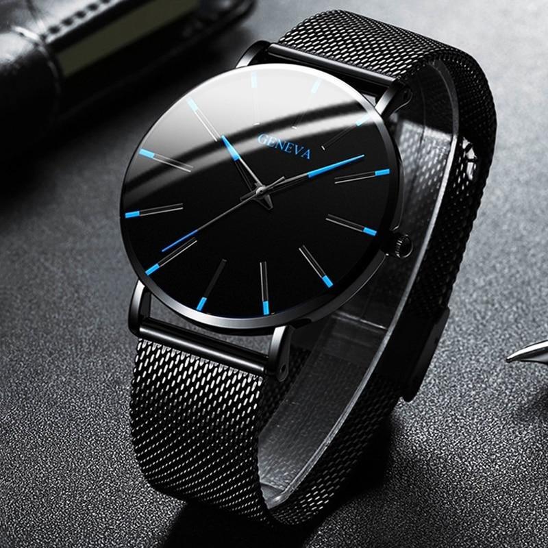 Contemporary men's accessory: minimalist watch with a black strap, sleek design, and vibrant blue accents.