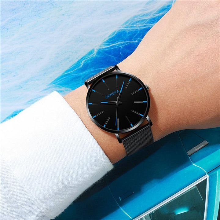 New classic men's watch: black strap, minimalist face, and distinctive blue hour markers for a modern look.