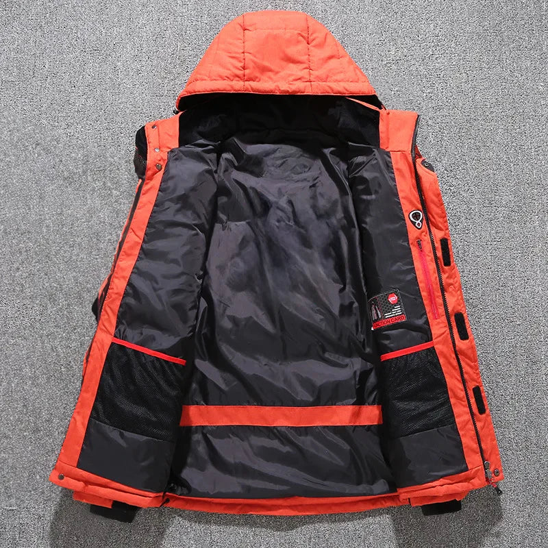 Man wearing a durable, insulated hooded parka jacket, ready for cold weather exploration.