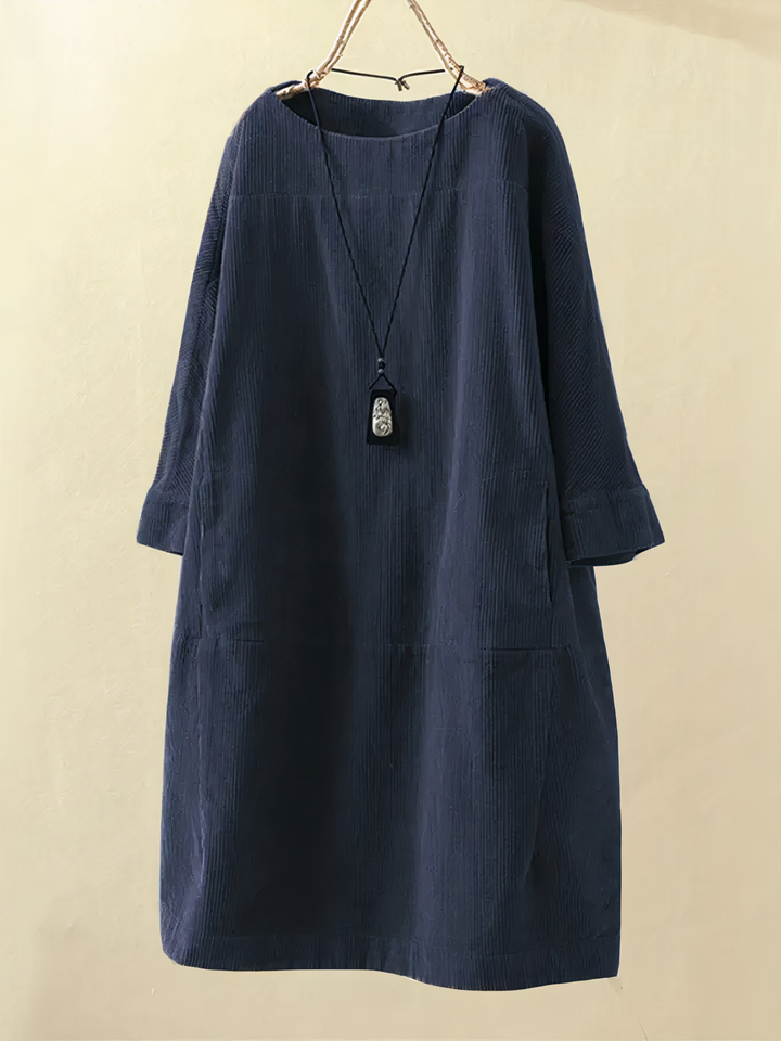 Comfortable women's midi dress for fall/winter. Features cozy fabric, pockets, elbow sleeves, modest round neck.