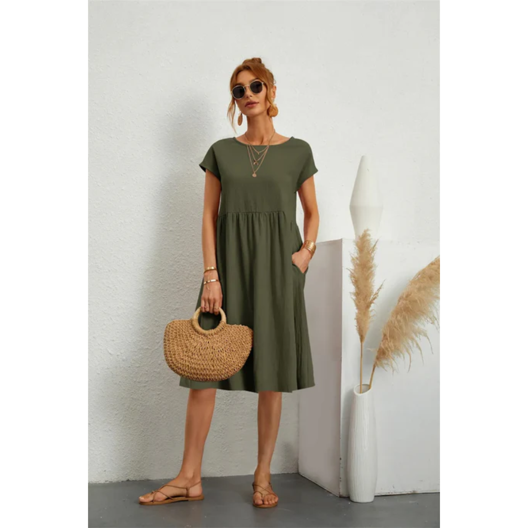 Versatile women's chic midi dress, cap sleeves, A-line cut, pockets, ideal for elegant summer casual.