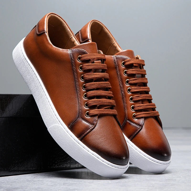 Stylish men's white leather low-top sneakers, comfortable and versatile casual shoes.