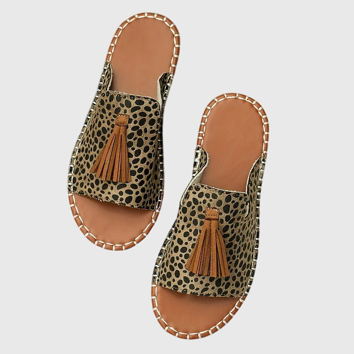 Women's slip-on summer sandals, providing ultimate comfort with charming tassel strap details.