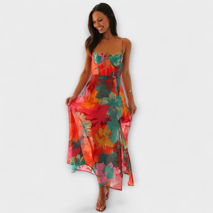 Elegant floral midi dress for women, ideal for summer events & parties. Flattering strap design with cool tones.