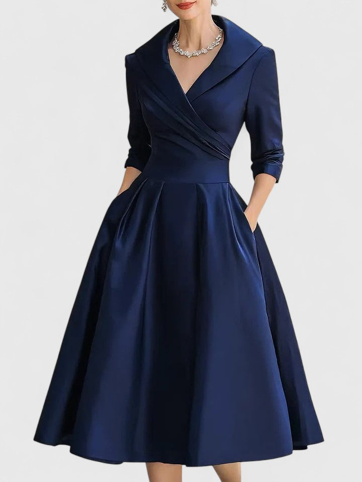 Women's wedding guest midi dress with elegant ruched detailing and a unique wrap collar. Perfect for formal occasions.
