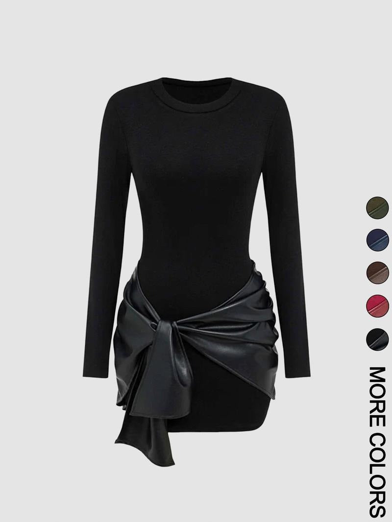 Full-length view of a woman wearing a black knit midi dress with a chic faux leather tie waist.