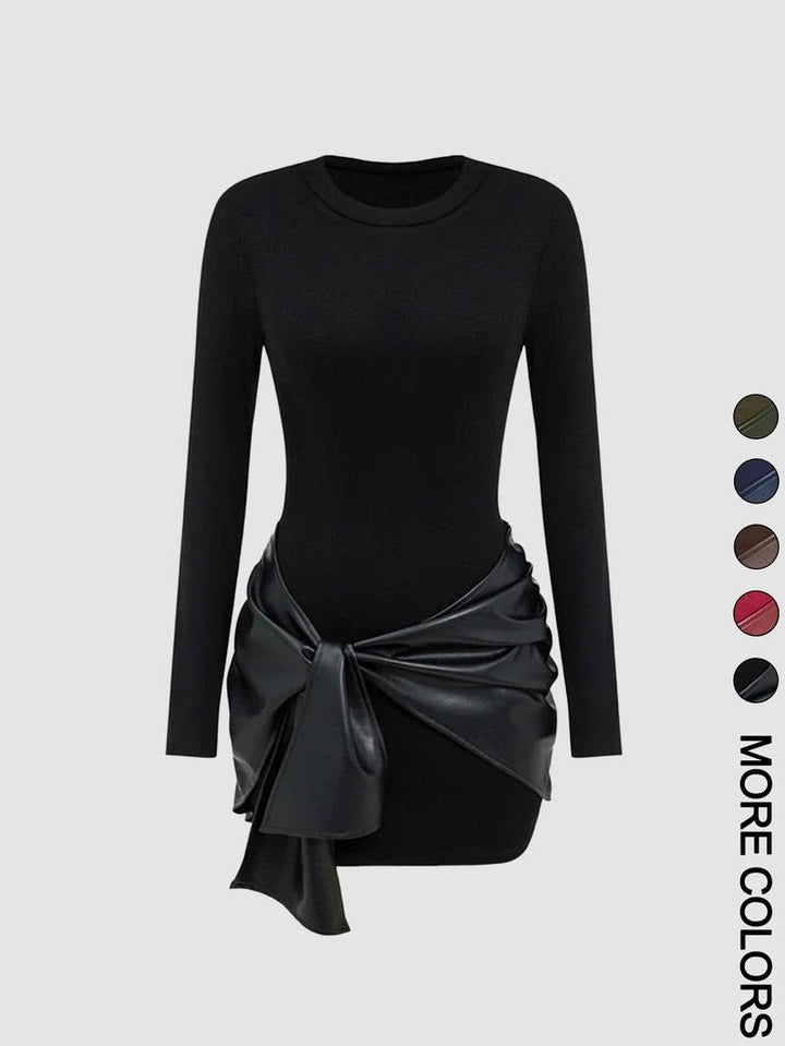 Full-length view of a woman wearing a black knit midi dress with a chic faux leather tie waist.
