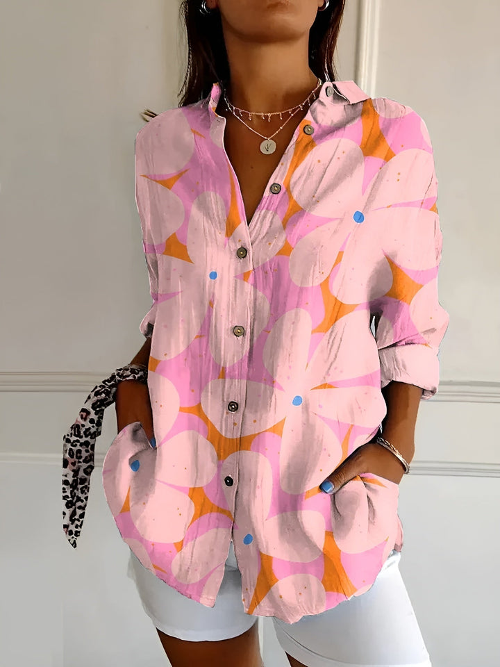 Women's casual printed blouse. Three-quarter sleeve top with button-front, collar, and beautiful floral pattern.