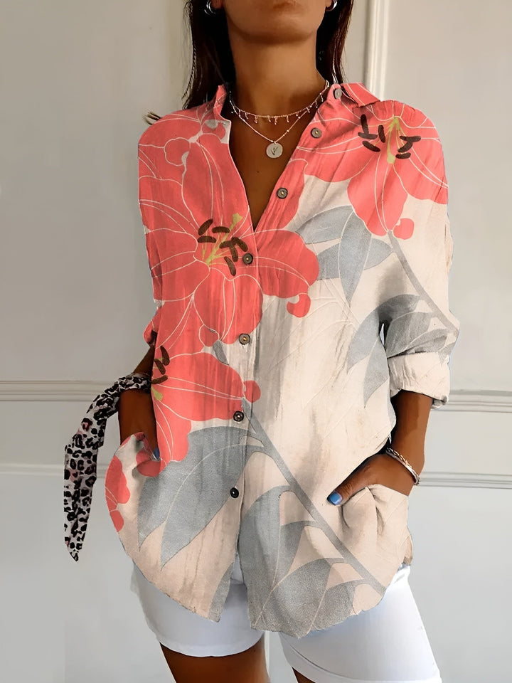 Elegant women's blouse. Stylish three-quarter sleeve top featuring a button-front and unique mixed floral prints.