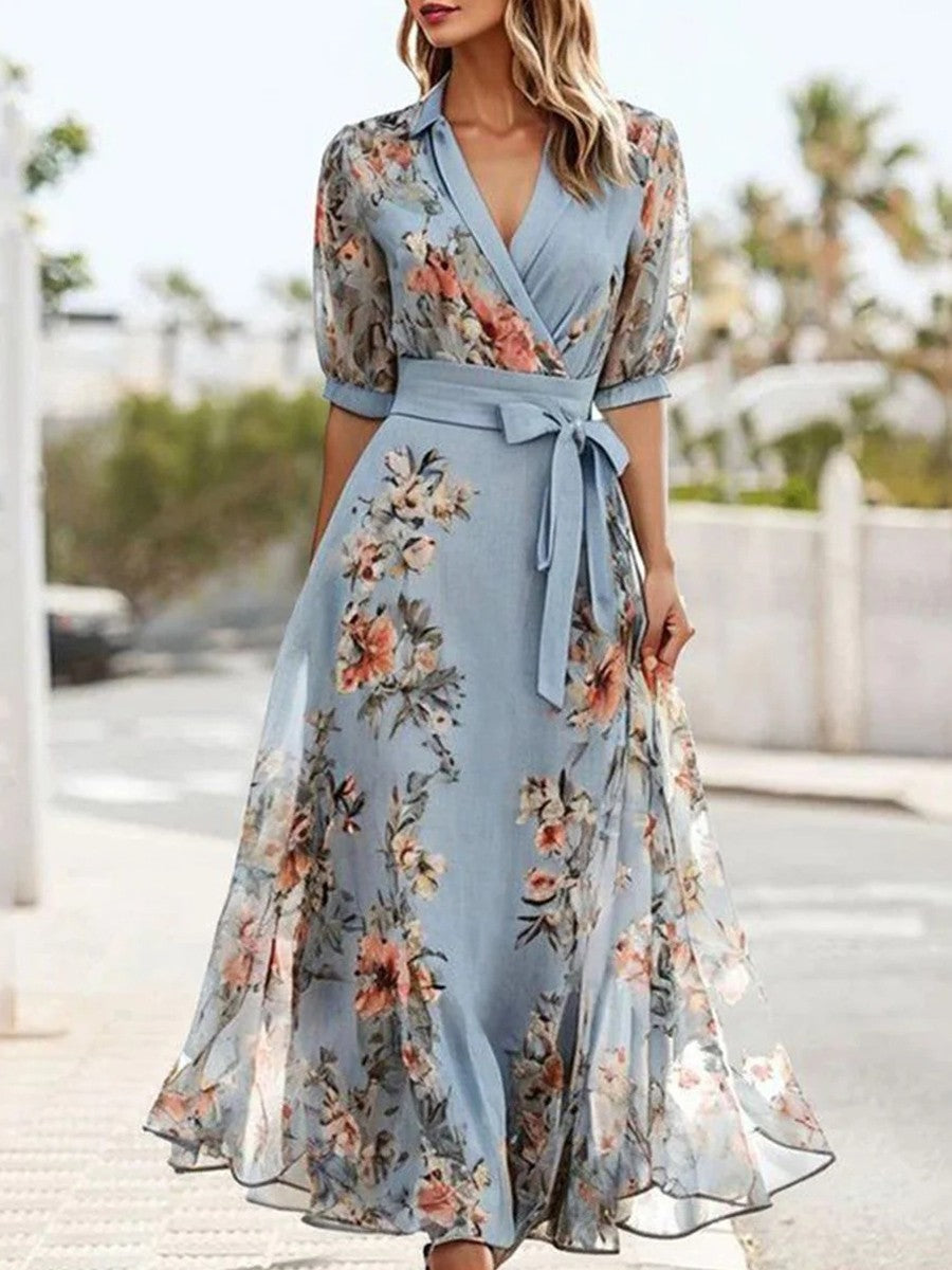 Elegant women's blue floral wrap maxi dress with a flattering belted waist & V-neck, perfect for summer parties.