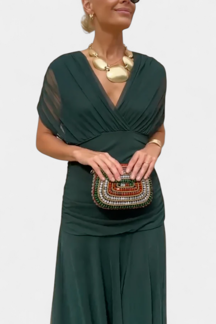 Elegant women's floral maxi dress on display, showcasing its captivating flowy design and vibrant floral print.