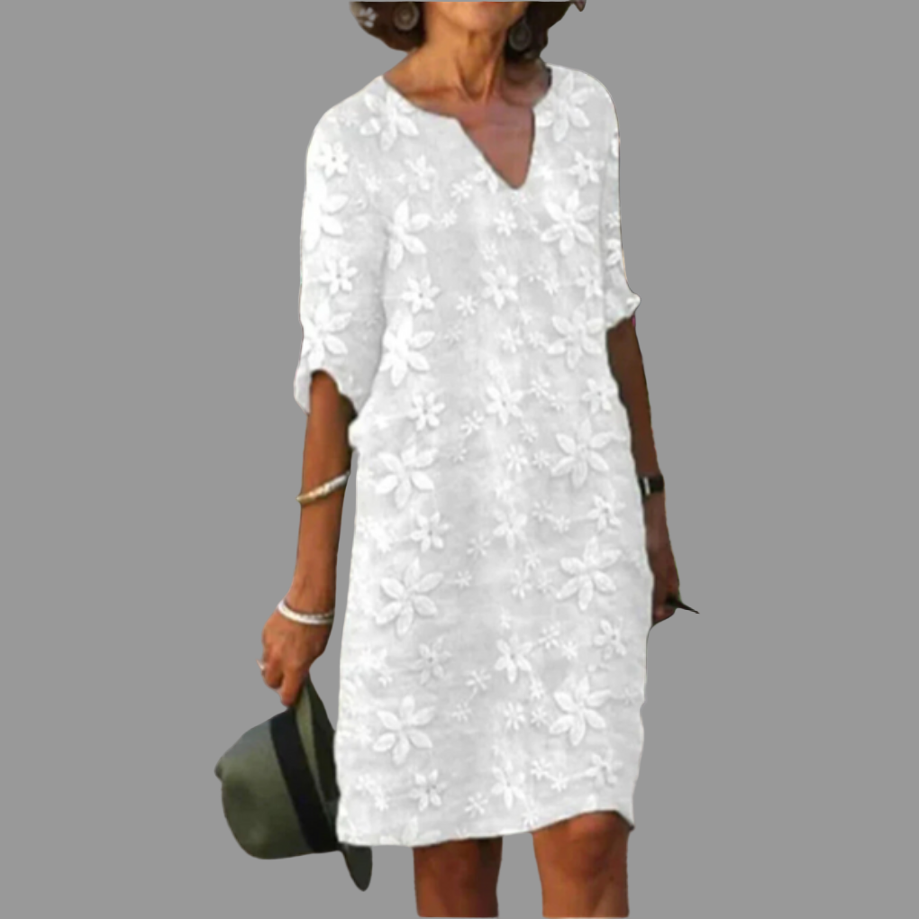 Relaxed fit elegant floral midi dress for women, featuring a flattering V-neck and stylish half sleeves.