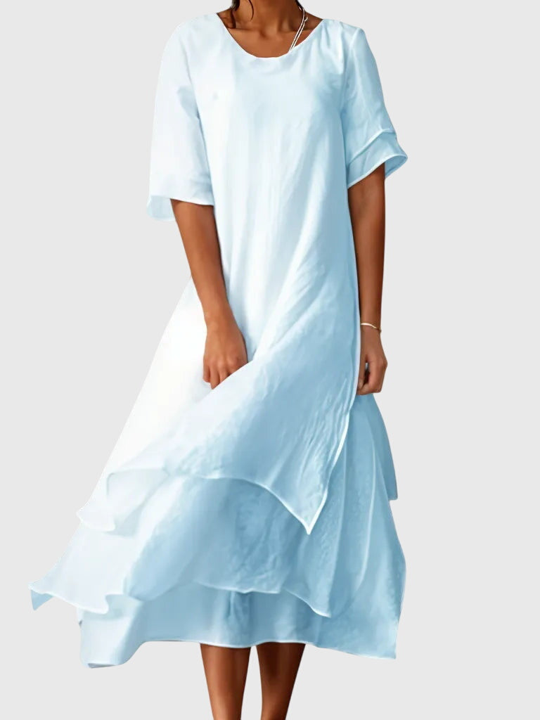 Chic women's flowy summer dress offering effortless style and comfort, great for any warm-weather event.