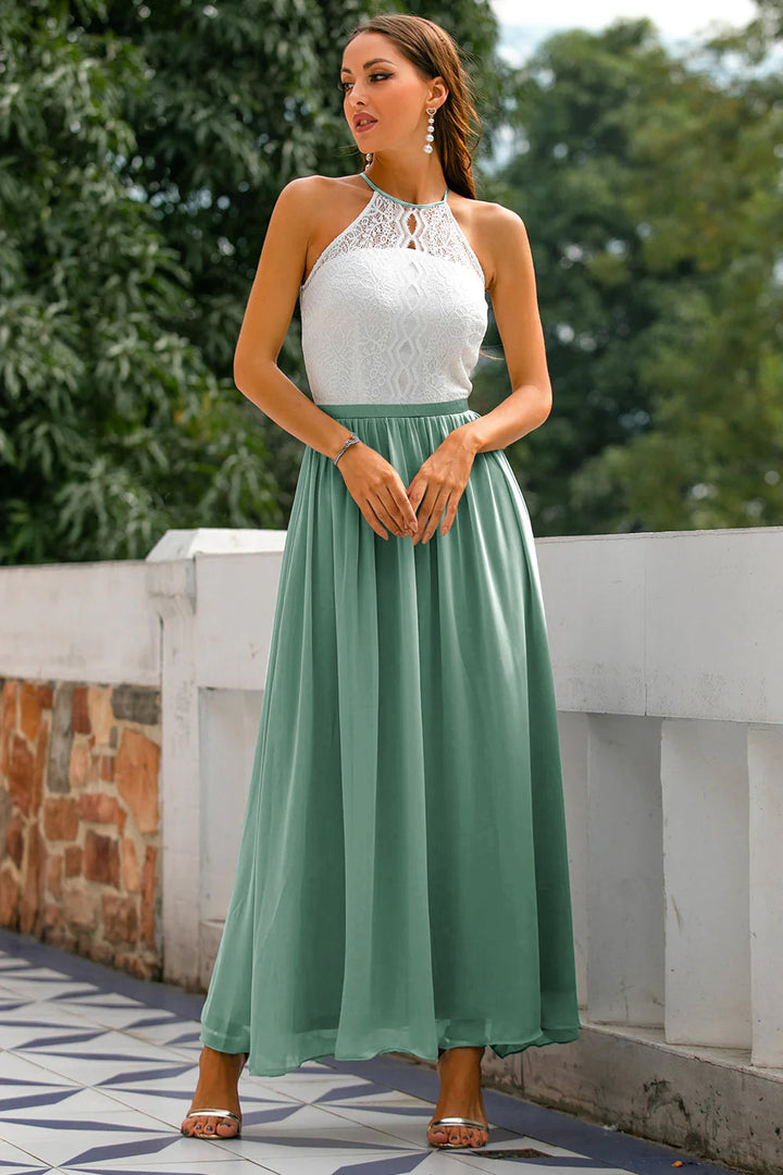 Model looking over her shoulder, showing the sophisticated cut of the halter neck formal dress.