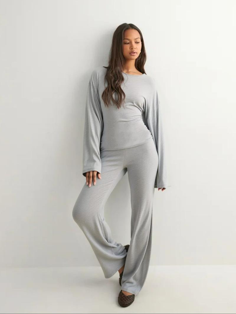 Matching women's knit lounge set featuring a comfortable top and wide-leg pants for leisure