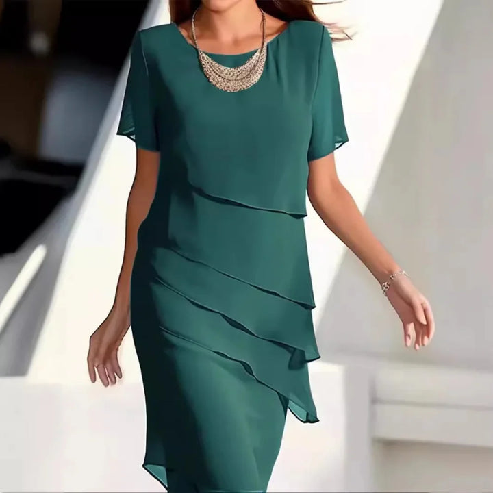 Stylish women's elegant midi dress. Perfect versatile short-sleeve summer dress for chic day-to-night looks.