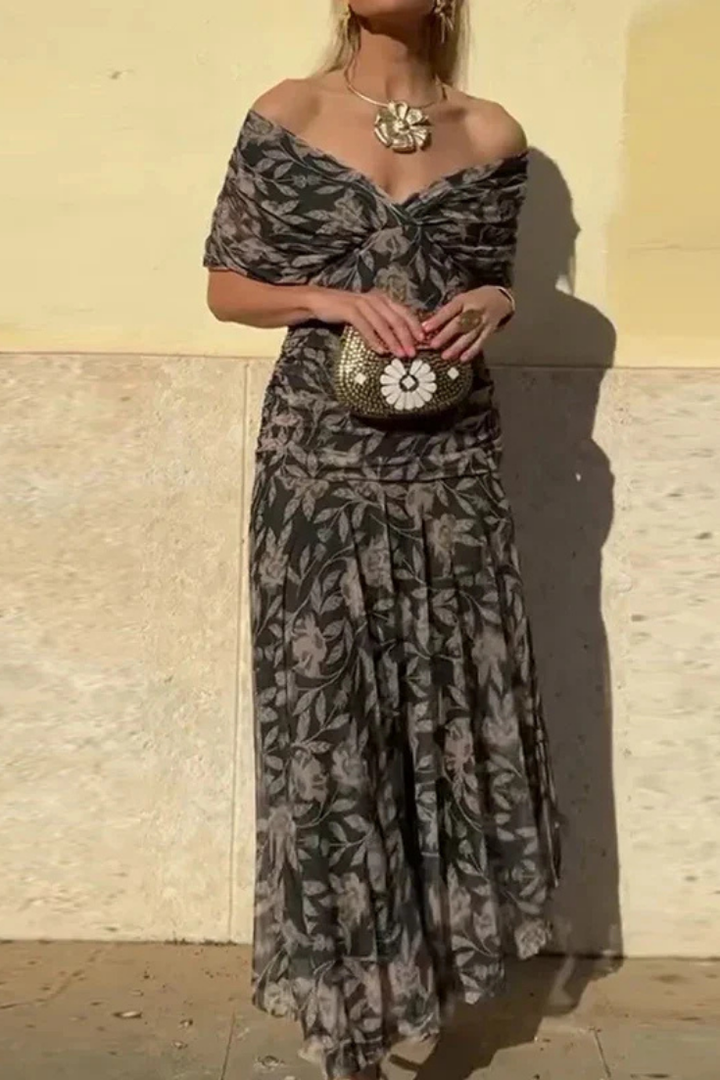 Women's off-shoulder cocktail party dress, highlighting the elegant ruched and twist front details.