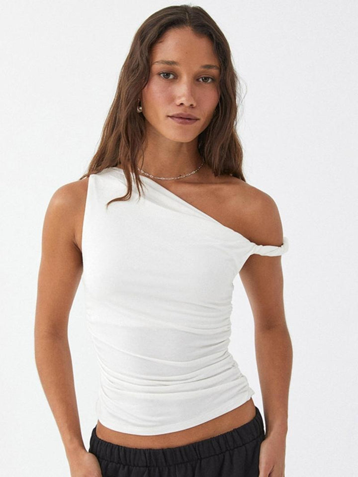 Casual women's blouse with an elegant one-shoulder neckline and ruched details, made from comfortable jersey fabric.